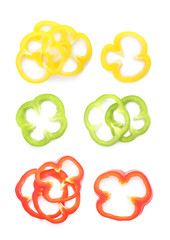 Set of sliced bell peppers on white background