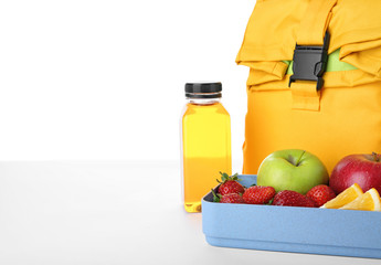 Lunch box with healthy food for schoolchild on white background. Space for text