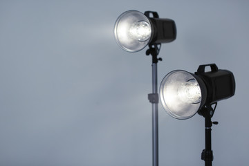 Studio lighting against gray background. Professional photo equipment