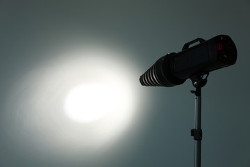 Studio lighting against gray background. Professional photo equipment