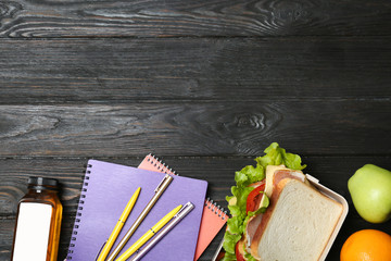 Flat lay composition with healthy food for school child and space for text on wooden background