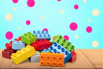 Toy building colorful children building bricks on background