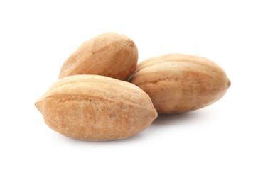 Pecan nuts in shell on white background. Nutritive food