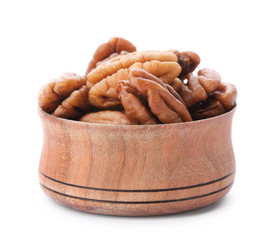 Ripe shelled pecan nuts in bowl on white background