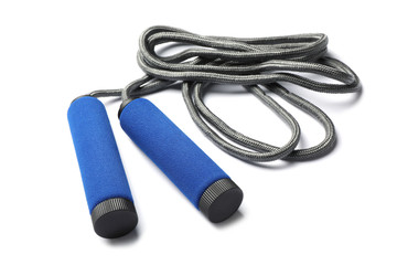 Jump rope on white background. Sports equipment