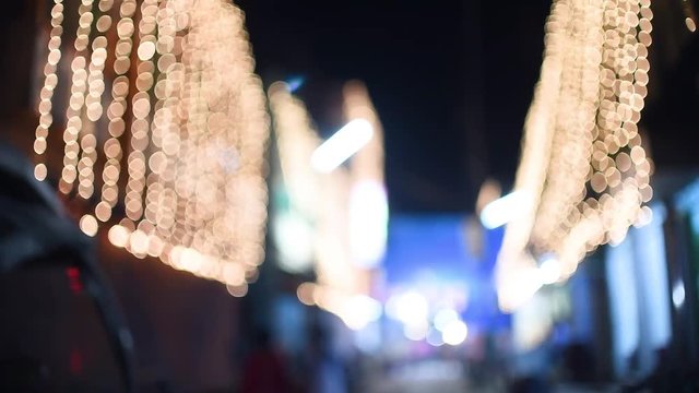Blurred light decorations on streets in India for Christmas and Diwali, slow motion