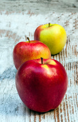 Apples surrounded by rustic background