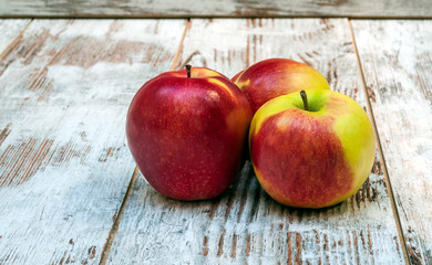 Apples surrounded by rustic background