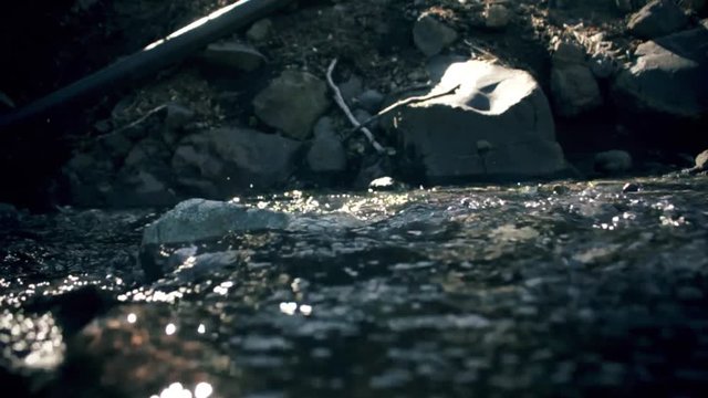 River flow slow motion 60 ftps into 24