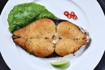 Deep fried Mackerel fish steak serve on plate