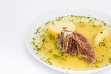 Traditional Colombian beef rib broth isolated on white background