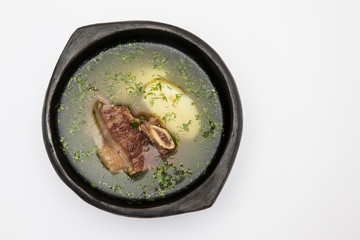 Traditional Colombian beef rib broth isolated on white background