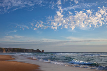 Clouds over Cape Woolamai beach, with the Pinnacles rock formation visible in the background