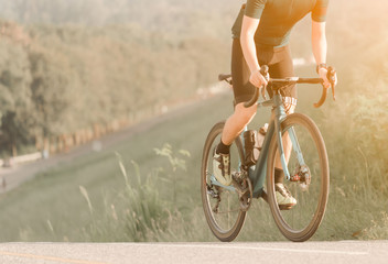 Racing Bike.Ride on bike on the road. Sport and active life concept in the summer time