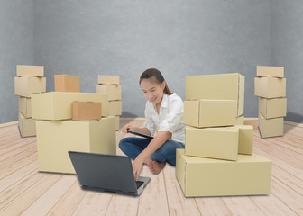 teenager owner business woman work at home with Clipboard, laptop for online shopping writing the order