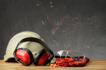 Safety Personal Protective Equipment(PPE) on a rustic black background.