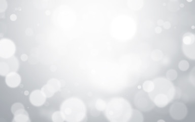 Obraz premium Silver light background with blur bokeh. beautiful christmas backdrop. festive defocused. cosmetic advertising design
