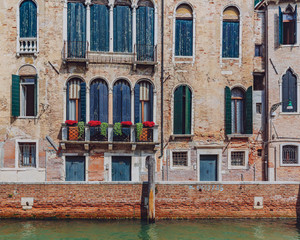 Fototapeta na wymiar Venetian houses by canal in Venice, Italy