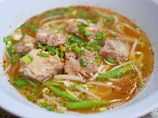 Close up of tasty spicy pork rib noodle soup - delicious and healthy street food in Thailand