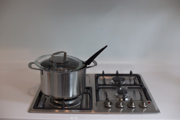 Bangkok, Thailand - June 29, 2018.Stainless steel cooking pot on a gas stove on a kitchen