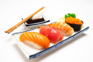 Sushi salmon & tuna sushi shrimp and wasabi on the white plate isolated.selective focus