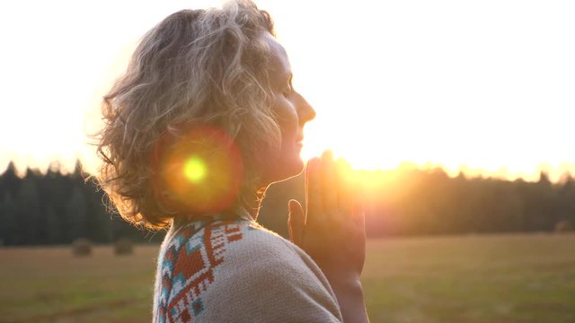Young Woman Praying, Practicing Yoga And Meditation At Sunset