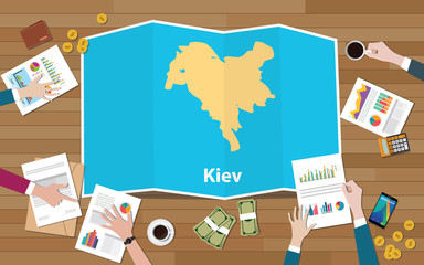 kiev ukraine capital city region economy growth with team discuss on fold maps view from top