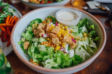 Salad dressing and sauces on the table.