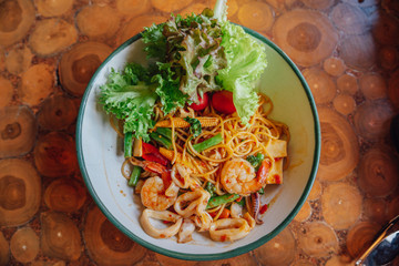 Spaghetti spicy seafood is placed on the table.
