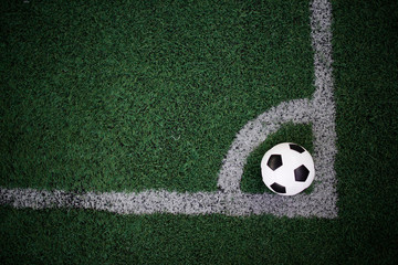 soccer ball on the white line at stadium