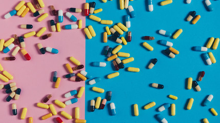 Medicine Healthcare Pharmacy Concept. Multicolored Pills On Lilac And Blue, Top View
