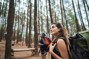 Fototapeta na wymiar two young female hiker walking in beautiful nature