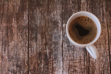 Coffee cup on vintage wooden table. Autumn, coffee break concept. October, November, winter drink, espresso