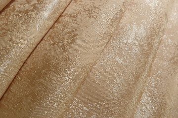 golden shiny fabric close-up macro background decor brocade silk organza textile