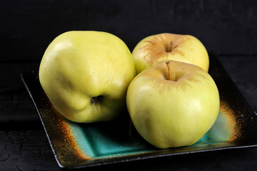 yellow apples varieties Antonovka on a plate