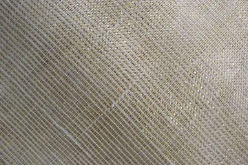 golden shiny fabric close-up macro background decor brocade silk organza textile