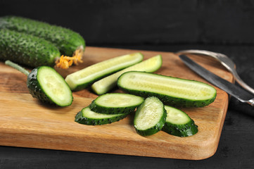 fresh green cucumbers whole and cut