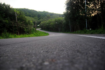 Road  pathway to success , The winding road to the mountain.Concept of the road for the success,Select focus.