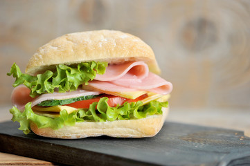 ham and cheese sandwich on wooden Board