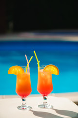 Cocktails on the background of the pool