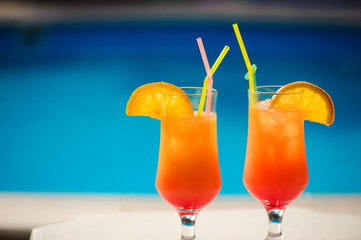 Cocktails on the background of the pool