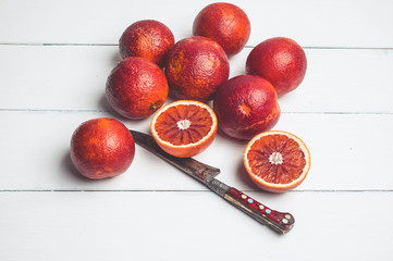 Sicilian Blood oranges on a white wooden background