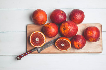 Sicilian Blood oranges on a white wooden background. Top view