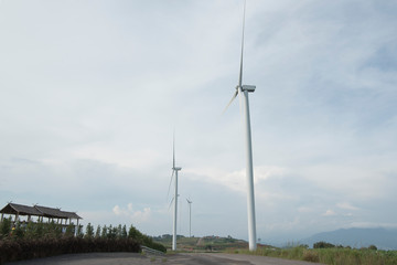 Fototapeta na wymiar Wind Turbine with Cloudy Sky
