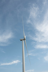 Fototapeta na wymiar Wind Turbine with Cloudy Sky