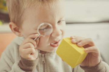 Educational games for children. A little boy plays in archaeological excavations.