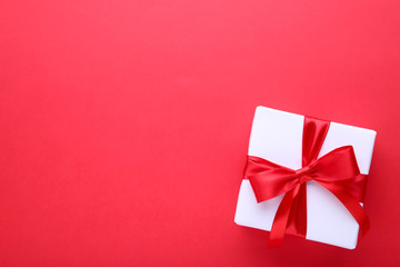 Gift presents box on a red background.