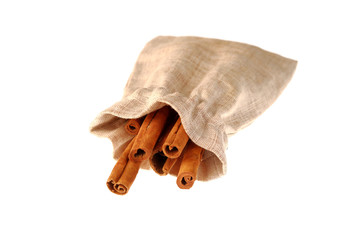 Cinnamon sticks in a pouch on white