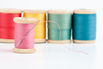 Old wooden coils of thread.