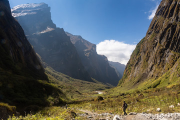 Two trekkers walking through glacier valley in Annapurna Base Camp trekking, Himalayas © JoseMiguel